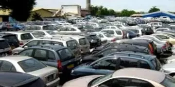Crowded car lot in urban Nigeria, reflecting rising vehicle imports and market demand.