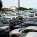 Crowded car lot in urban Nigeria, reflecting rising vehicle imports and market demand.